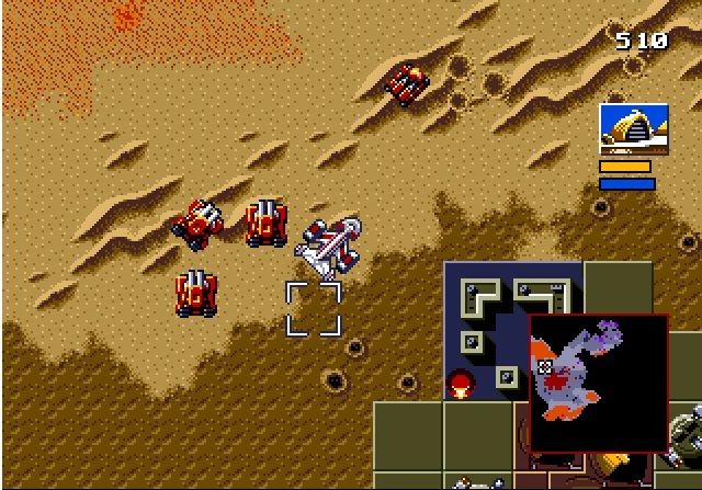 На скриншоте видны все типы поверхностей в Dune II. Красная пыль &mdash; это спайс, светлая область &mdash; песок, часть её покрыта дюнами. На тёмной области можно строить базу. В правом нижнем углу &mdash; горы.